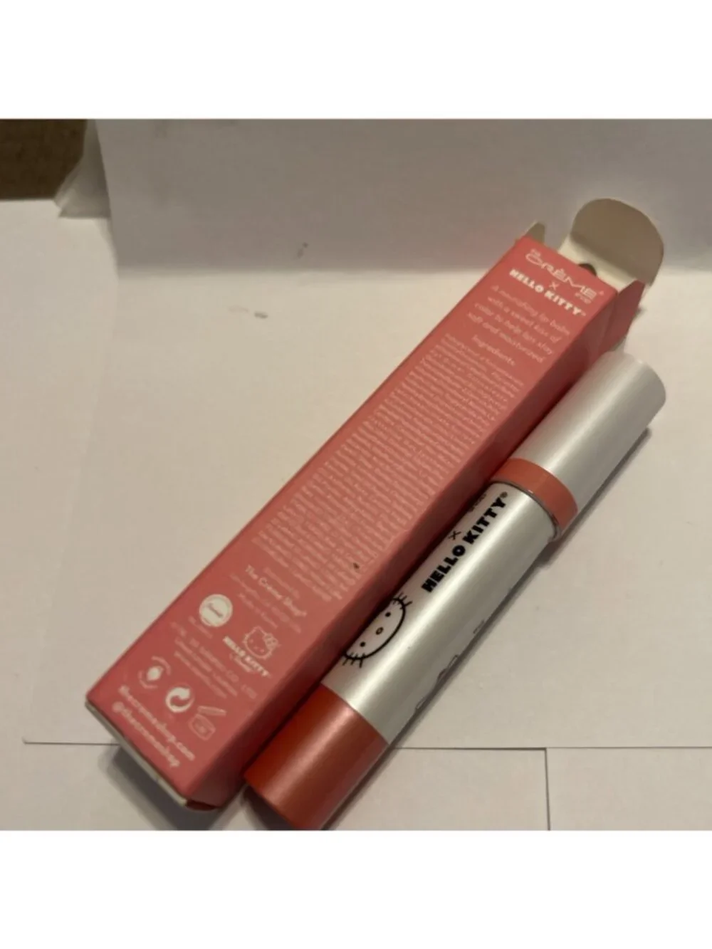 The Crème Shop Hello Kitty & Friends Tinted Peach Moisture Lip Balm Stick .09oz